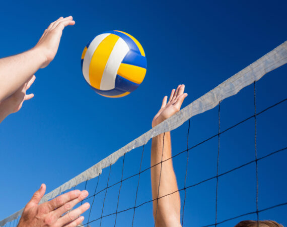 Friends playing volleyball