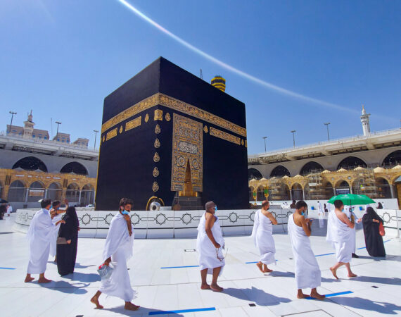 The Holy Kaaba Mecca - Pilgrims return to Masjid al-Haram in Makka for limited umrah as  coronavirus restrictions - face mask wearing Muslims perform umrah